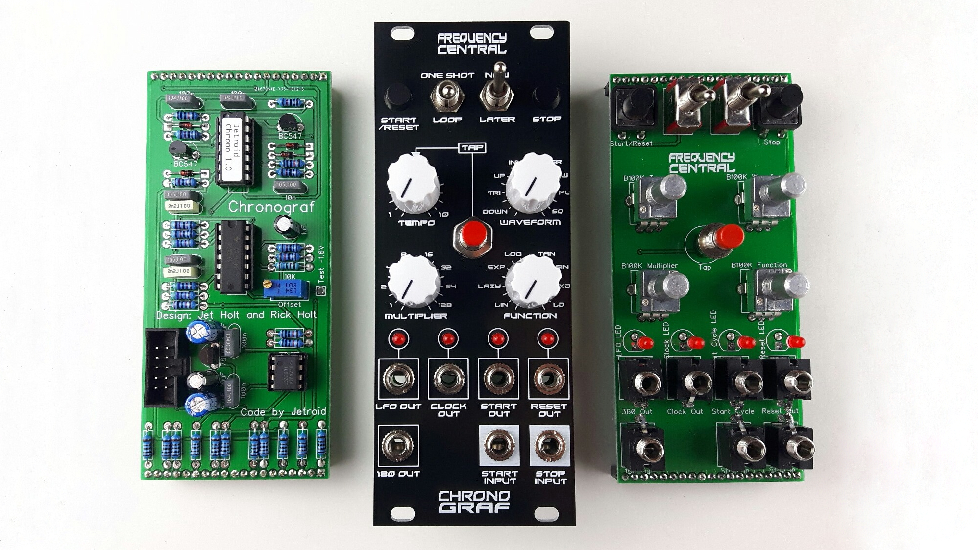 Assembled Frequency Central Chronograf module next to two populated PCBs.