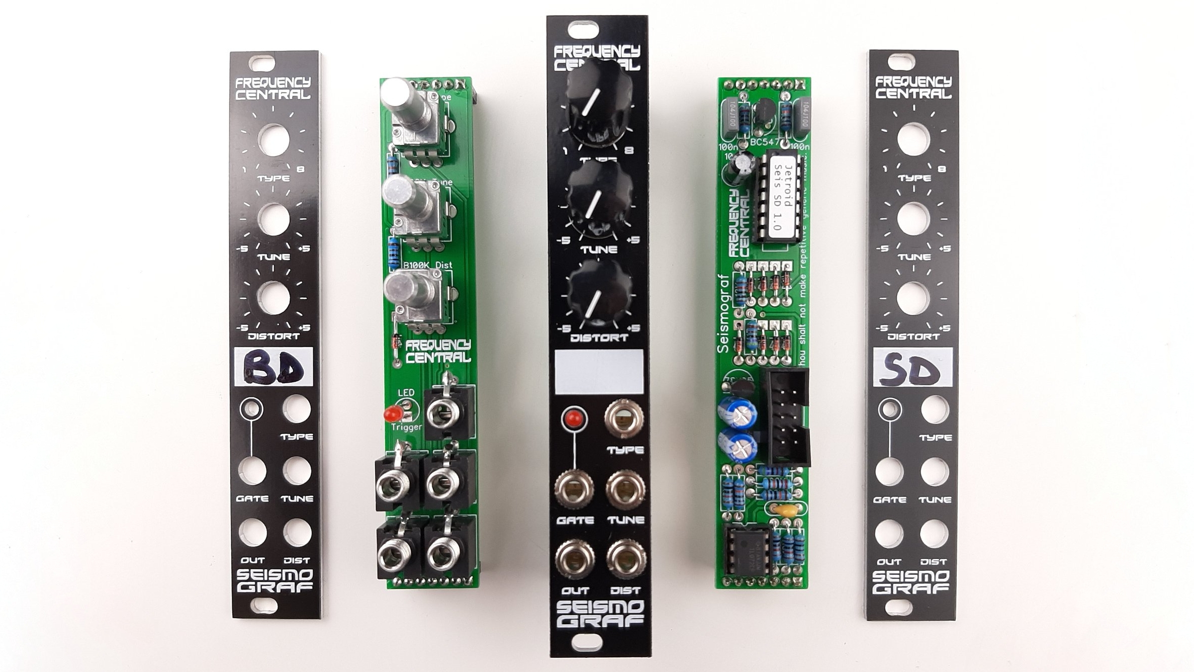 Frequency Central Seismograf module broken down into it's constituent parts; two panels, two circuit boards, and an assembled module are visible.